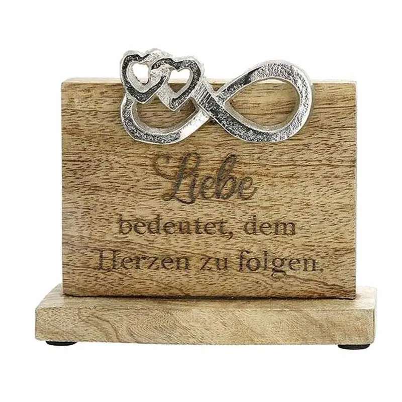 Holzbild mit Spruch "Liebe bedeutet, dem Herzen zu folgen."